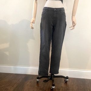 Distressed black denim tapered jeans with black sequin embellishment down legs.